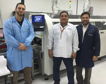 Members of the Jabil team pose with Brian Booth, Sono-Tek regional sales manager, in front of the wave solder machine at the installation facility in Manaus, Brazil.From left to right, Brian Booth (Sono-Tek Regional Sales Manager), Adwilson Sevalho (Jabil – wave solder engineering expert), Roberto da Cruz (Plottec/Sono-Tek Representative for Brazil) 